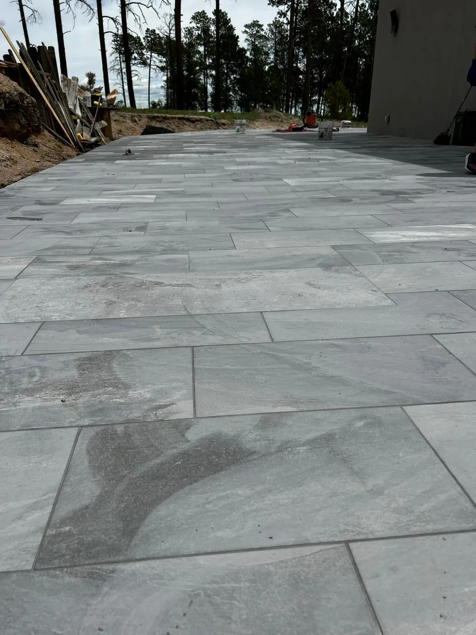 Gray tile flooring beside sliding glass doors