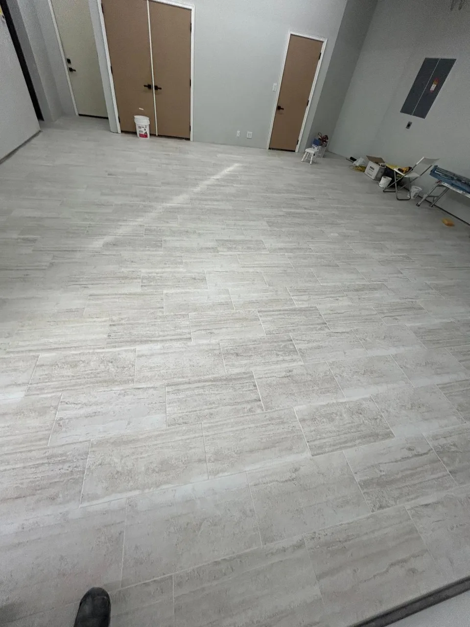 Light gray plank flooring in an open room