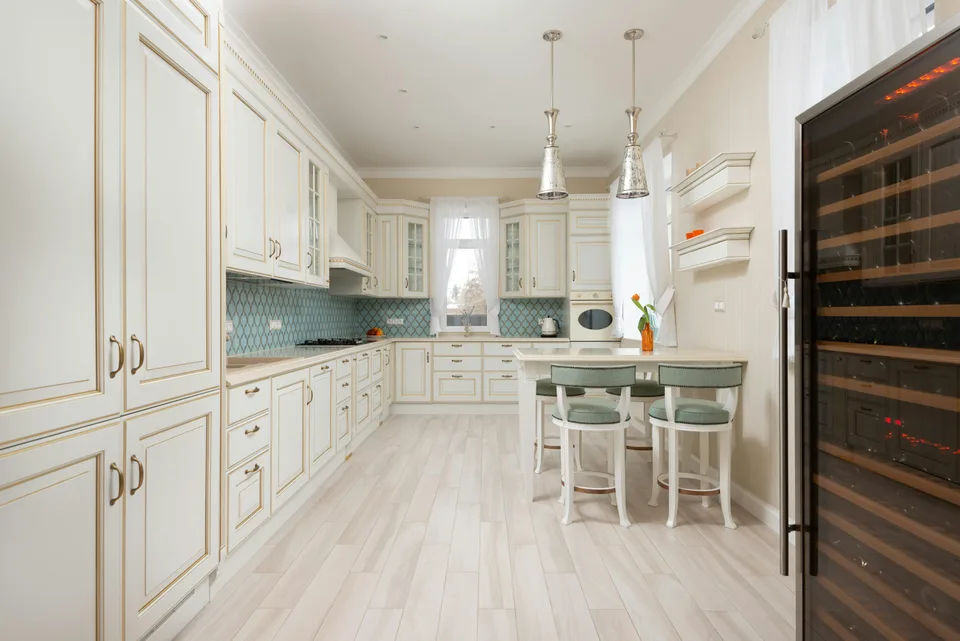 Light flooring in a cream cabinet kitchen